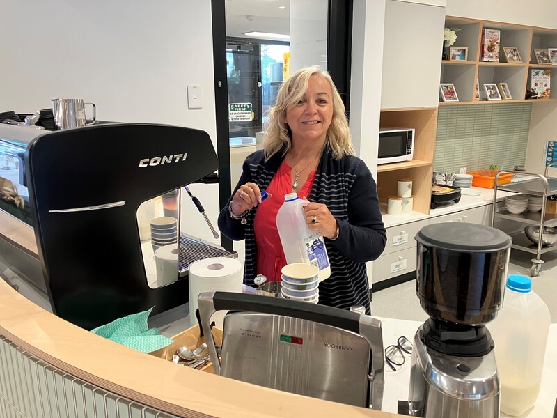 Lia, Chair of the PCG, making coffee at Frankie's Cafe